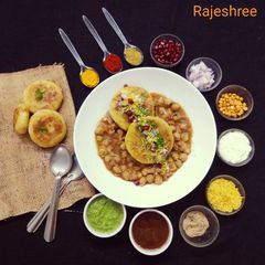 A picture of Chole Stuffed Aloo Tikki Chaat.