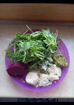 A picture of Rucola-Pickled Beets-Banana plate with sesame and basil pesto.