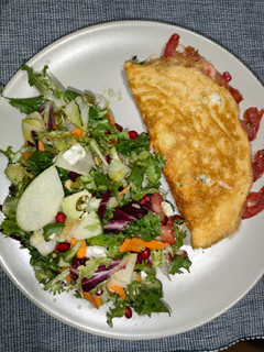 Una foto de Tortilla de espinacas y tomate