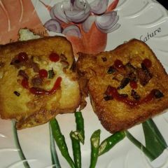 A picture of Egg and bread toast (dim paurooti).