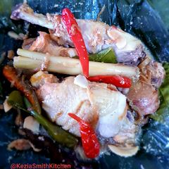 A picture of GARANG ASEM (Chicken Steamed in Banana Leaves).