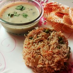 A picture of Kadi and matar pulao.