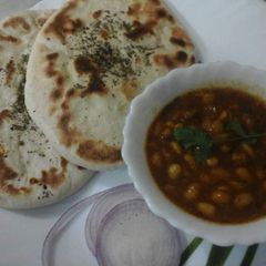 A picture of Soyabean seed curry with kulcha.
