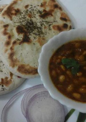 A picture of Soyabean seed curry with kulcha.