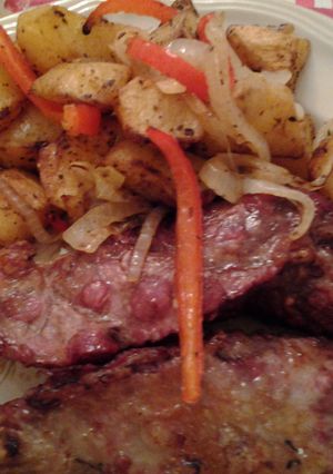Una foto de Papas al horno con tapa de nalga