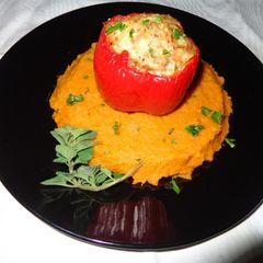 A picture of RED BELL PEPPERS STUFFED WITH CHICKEN OVER SWEET POTATOES PUREE. JON STYLE.