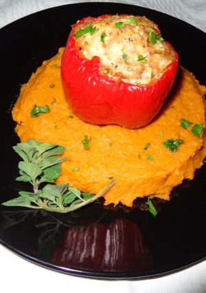 A picture of RED BELL PEPPERS STUFFED WITH CHICKEN OVER SWEET POTATOES PUREE. JON STYLE.