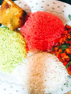 A picture of Colorful Christmas Rice with Veggies and grilled Chicken.