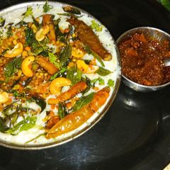 A picture of Ancient probiotic South Indian style curd rice with mango pickle.