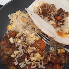 A picture of Chilli beef with egg fried rice.