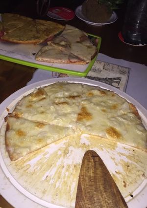 Una foto de Pizza y fainá