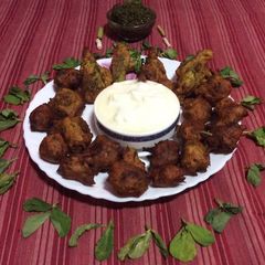 A picture of Methi gota (green fenugreek leaves gota).