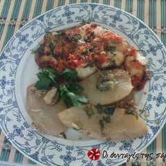 A picture of Tope shark in the oven with tomatoes and caper.