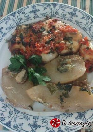 A picture of Tope shark in the oven with tomatoes and caper.