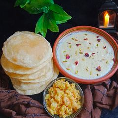 A picture of Lucchiyan, Aloo Tarkari & Kheer.