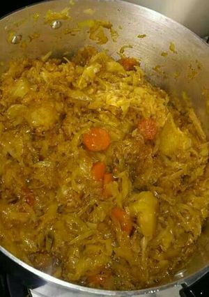 A picture of Fried cabbage and carrots.