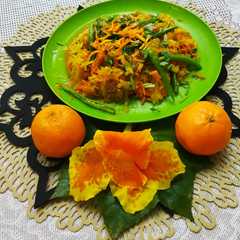 A picture of কমলার  খোসা কুচি দিয়ে মূলা ও গাজর ভাজি। Carrot and  Radish stir fry with Orange peel.
