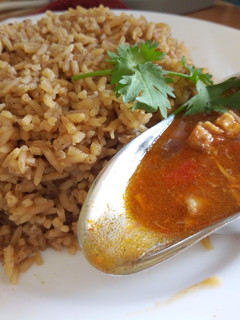 A picture of Pilau with chunky chicken soup.