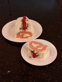 A picture of Fresh Rasberry Cake Roll with Whipped White Chocolate Ganache Filling and Frosting.