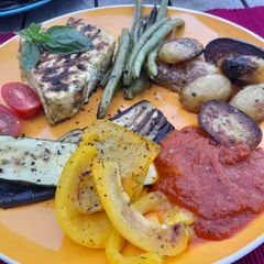 A picture of Grilled veg and tuna steak.