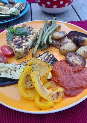 A picture of Grilled veg and tuna steak.