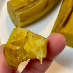 A picture of Steamed Banana eating with Skin on.