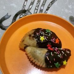 A picture of #Holi2022#Holi special - Chocolate dipped Gujiya.