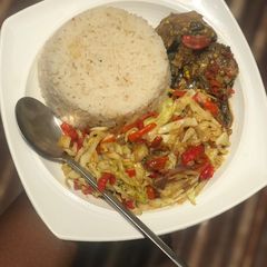 A picture of White rice with cabbage sauce.