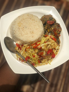 A picture of White rice with cabbage sauce.