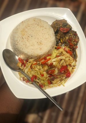 A picture of White rice with cabbage sauce.