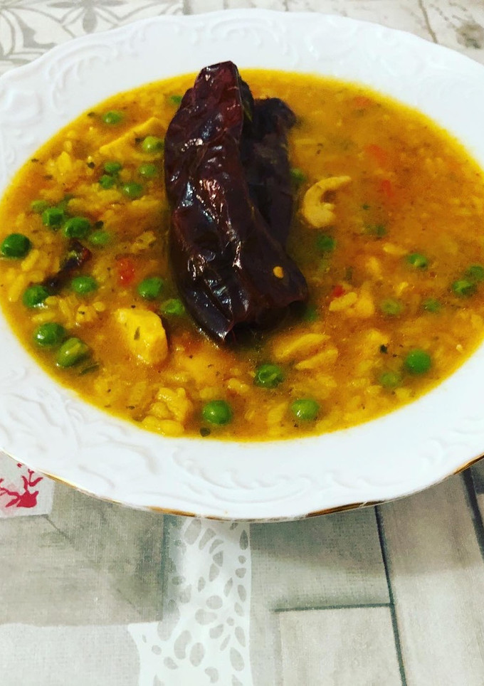 Una foto de Arroz con pollo y bacalao