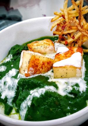 A picture of Palak Paneer/Spinach Gravy with Cottage Cheese.