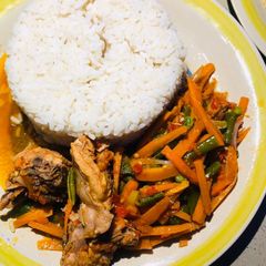 A picture of Chicken veggies sauce and rice.