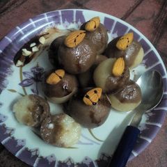 A picture of Two In One brown semolina rasgulla.
