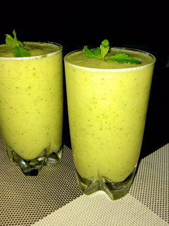 A picture of Pineapple, apple, banana and mint.