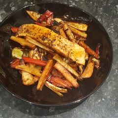 A picture of Marinated salmon with honey roasted paprika veg.