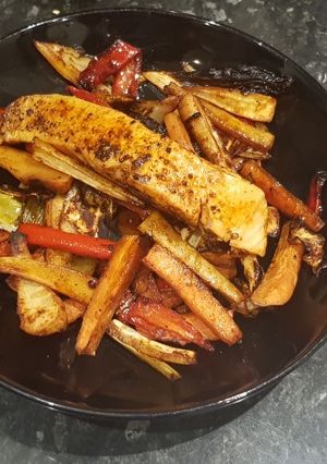 A picture of Marinated salmon with honey roasted paprika veg.