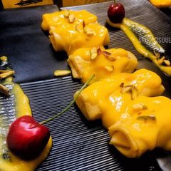 A picture of Mango Malai Khandvi.