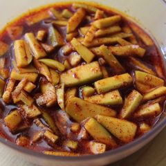 A picture of Menthi Mukkallu /Raw Mango pieces In Menthi Powder.