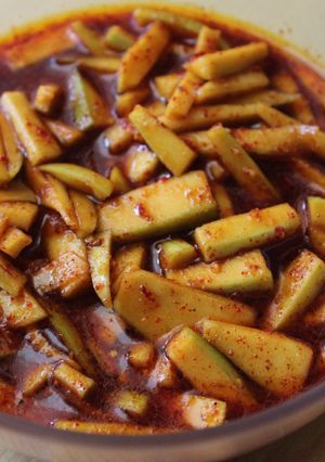 A picture of Menthi Mukkallu /Raw Mango pieces In Menthi Powder.