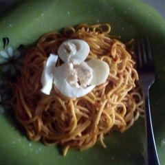 Jollof spaghetti and egg A picture of Jollof spaghetti and egg.
