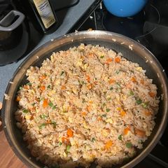 A picture of Chicken fried rice or fried rice.