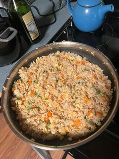 A picture of Chicken fried rice or fried rice.