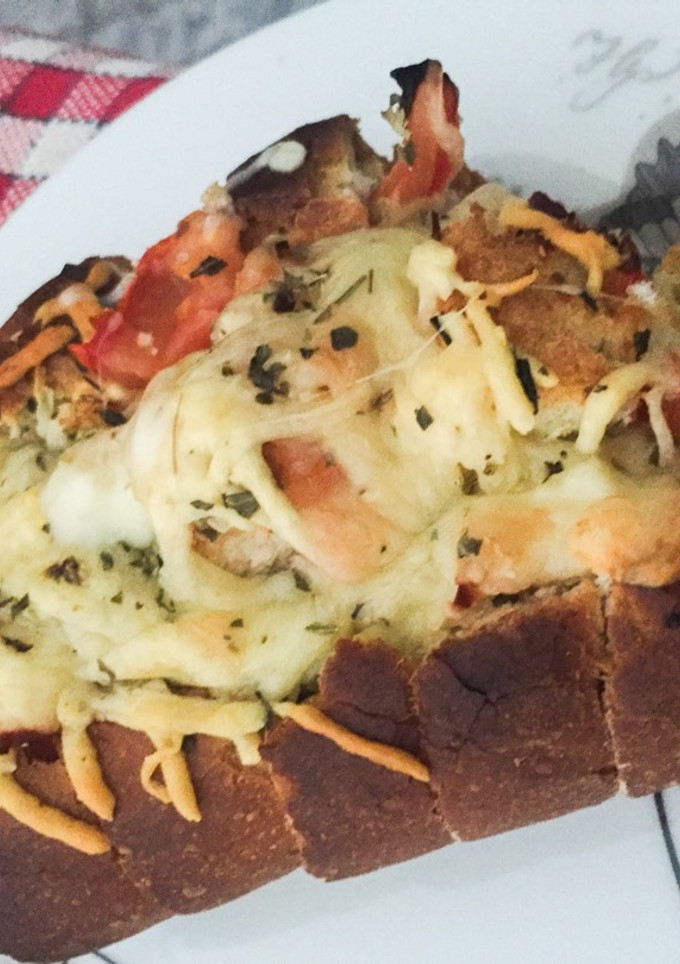 Una foto de Pan con queso fundido
