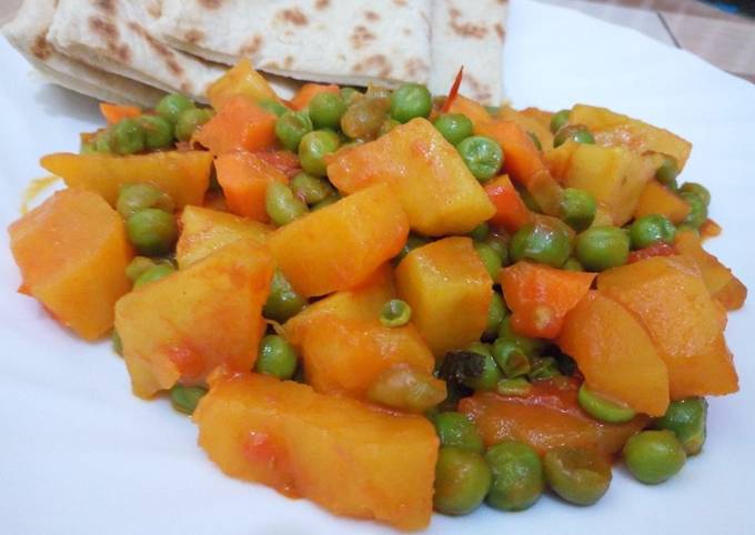 Sweet Potato Curry and peas served with naan bread