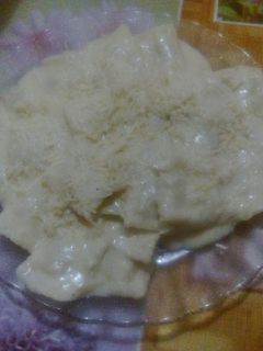 Una foto de Ravioles con salsa blanca