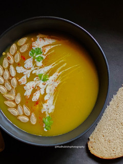 A picture of Creamy Cheesy Pumpkin Soup.