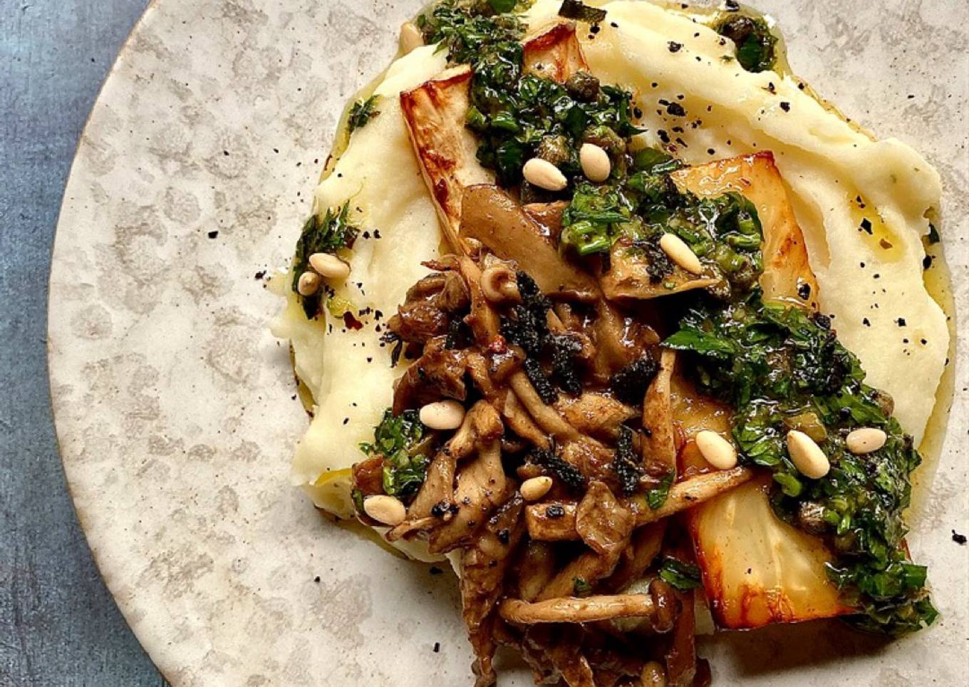 Celeriac steak with sautéed wild mushrooms and salsa verde