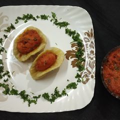 Luchi with Bangali dum aloo A picture of Luchi with Bangali dum aloo.