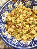Orecchiette with Squash Blossoms, Sun-Dried Tomatoes, and Creamy Cacio Ricotta